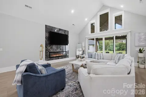 Spacious great room with soaring ceilings and expansive windows