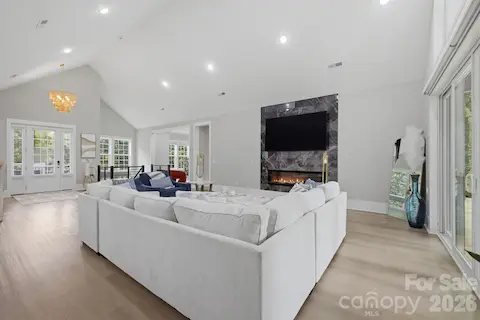 Great room featuring fireplace and abundant natural light