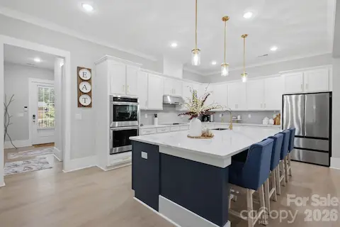 Bright kitchen with abundant cabinetry and generous workspace
