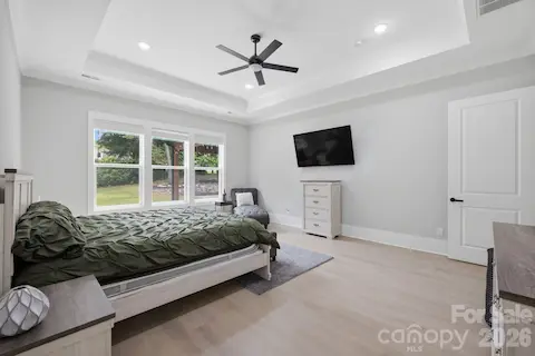 Primary suite with generous proportions and peaceful backyard views