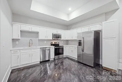 Full lower-level kitchen with ample cabinetry
