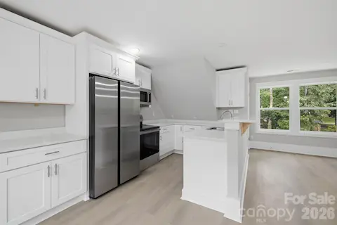 Open kitchen and living area in the private second living quarters