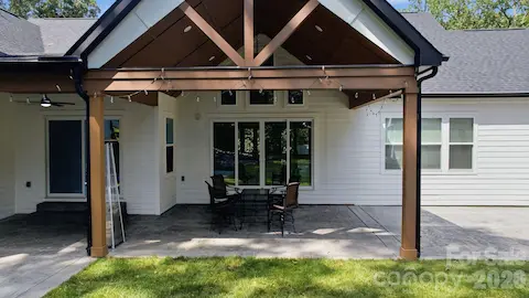 Generous covered porch extending the home’s living space outdoors