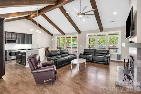 Great Room open to kitchen and eat in area, fantastic beamed and vaulted ceiling!
