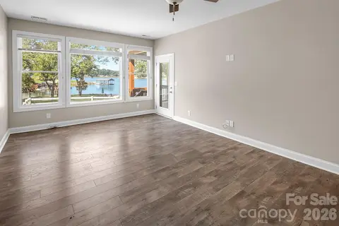 Primary Bedroom on the main. just look at that view. Also features access to the back deck.