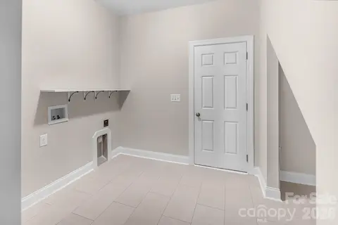 Laundry Room with tons of space, easily add a drop zone.