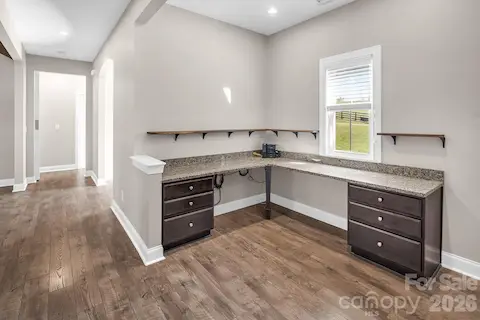 Office area on the main floor features fabulous built ins