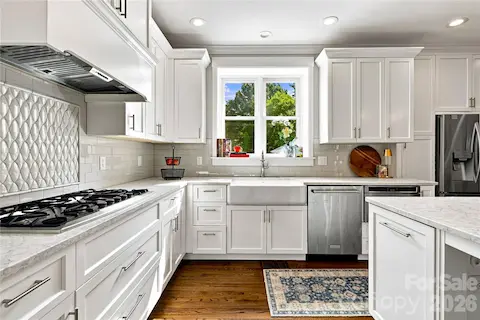 Large gas cooktop and farmhouse sink