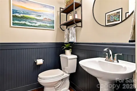 Half bath on main with beadboard accents