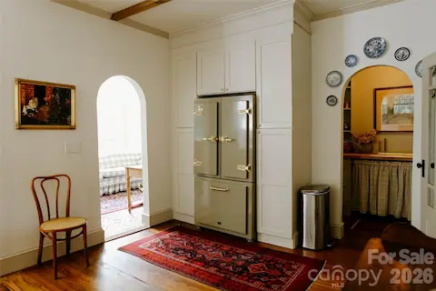 view from kitchen into butler's pantry and sunroom