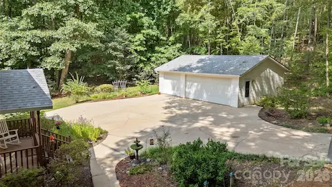 Three car detached garage with new roof in 2026