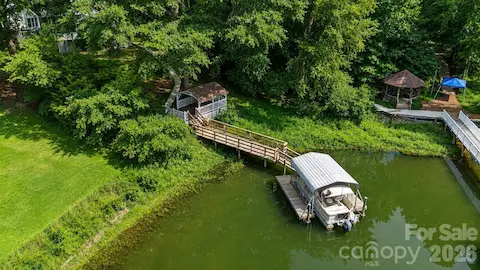 Private waterfront retreat with deep water covered dock.