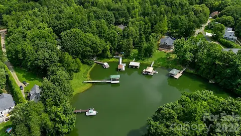 Private waterfront retreat with deep water covered dock.