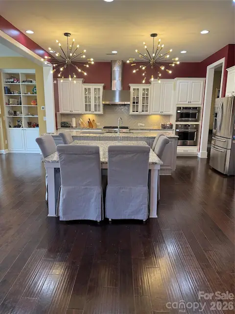 Spacious Gourmet Kitchen with Gas Cooktop and Oven, Electric Double Oven, Island w/adjoining table top