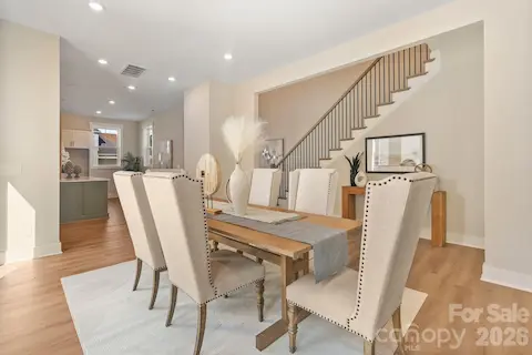 Formal dining area - seamlessly connects the kitchen with the family room.  Plus, there is a side patio off the dining area