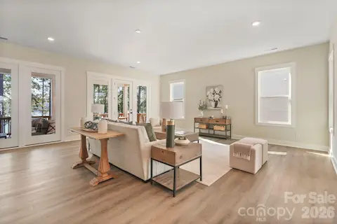 Spacious family room pre-wired for surround sound and includes glass doors to covered deck