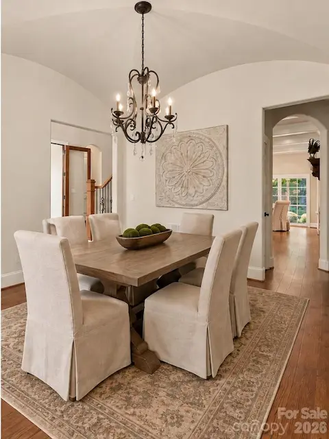 Formal Dining Room looking towards the entry and Kitchen (virtually staged)