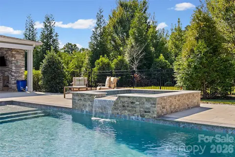 Spa with waterfall into the pool