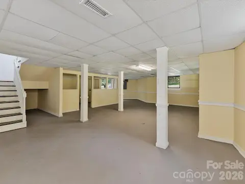 Expansive finished lower level offers flexible bonus space with endless possibilities for a recreation room, home gym, media room, workshop, or additional living area.