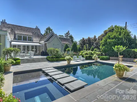 Resort-style backyard with saltwater pool and spa