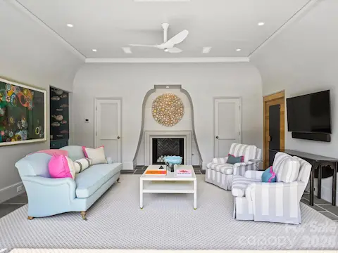 Pool house has fireplace and Nano doors that open it to the backyard
