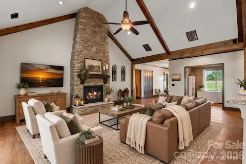 Gorgeous family room with vaulted ceilings and stone fireplace.