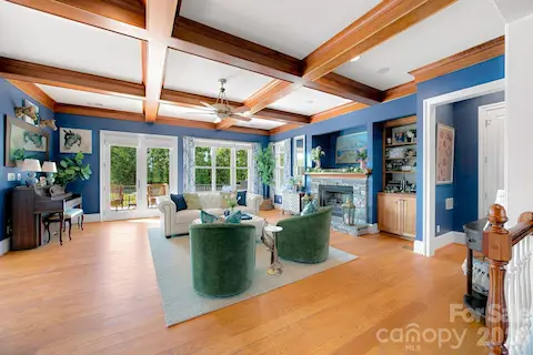 Stately living room with gas log fireplace and built-ins