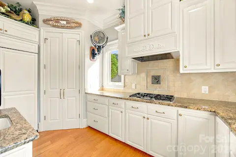 Kitchen features professional Thermador, Dacor, KitchenAid & GE Appliances
