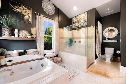 En-suite spa-like bathroom with walk in closet