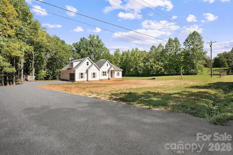 A long driveway leads you to your forever home!