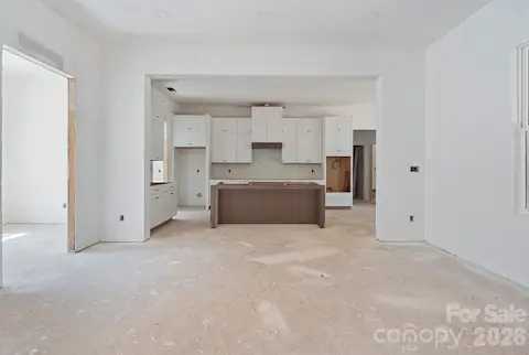 This open concept design has 10' ceilings in the main living spaces & lots of windows.