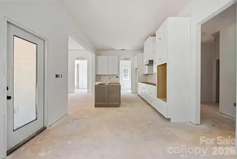 The dining area leads to the covered back porch - great for indoor/outdoor living.