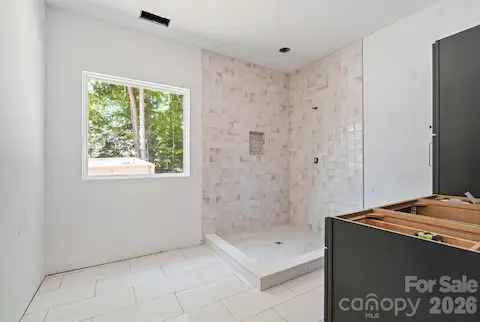The big window over the tub lets natural light pour in.