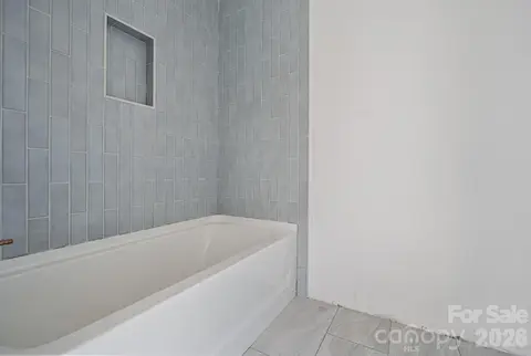 Private upper full bath with gorgeous tile!