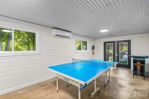 Recreation room with lake view, separate mini split and vintage Ms Pac Man