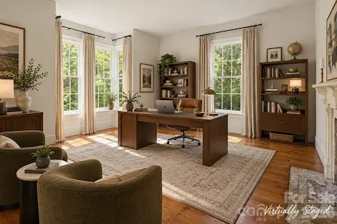Living room, office or "Parlor" has the most ornate fireplace mantle of the 8 fireplaces all with original wood mantles.Wide plank hardwood floors throughout both original and matching in the renovated areas and/or additions