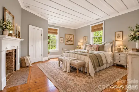 Three large bedrooms, all with fireplaces and original wood mantles, board-and-batten ceilings. Rugs cut to room dimensions can are just sitting on the hardwood floors.