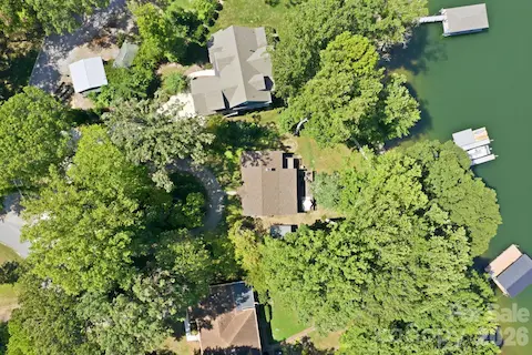 Bird's eye view. See how this home sits perfectly on its wooded lot.