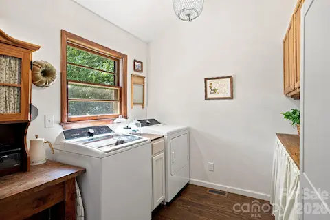 Laundry made easy, tucked just off the kitchen & primary
