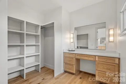 1 of 2 primary closets upstairs, the second closet has washer / dryer hook up