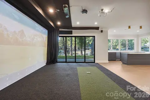 State-of-the-art golf simulator featuring multi-sport capabilities and a 4K projection system, seamlessly transforming into a private home theater for the ultimate entertainment experience.