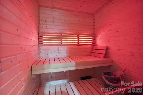Private wellness center featuring a built-in sauna, creating a dedicated space for relaxation and recovery in the comfort of home.