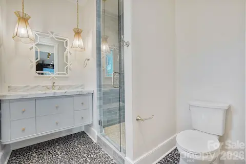 Thoughtfully designed basement bath provides convenient access from the outdoor living areas, helping keep wet traffic contained on the lower level, with a dedicated laundry room located just steps away.