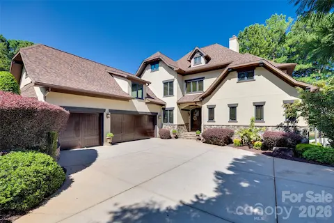 Distinctive architecture, stone accents and mature landscaping welcome you home