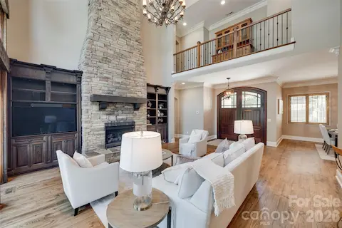 Great room with floor to ceiling stone fireplace
