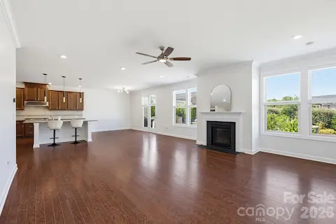 The kitchen and family room flow together in one bright, open space designed for the rhythms of everyday life