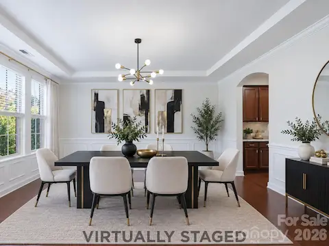 Virtually staged, the formal dining room is ready for holiday dinners, birthday celebrations, and the meals everyone will remember.