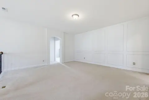 The oversized upstairs loft, featuring classic wainscotting, provides room to grow as your needs change over the years