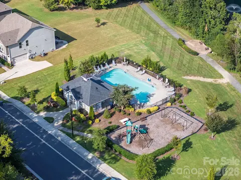 An aerial view brings the Churchill Farms amenities together, including the pool, cabana, playground, and surrounding green space.
