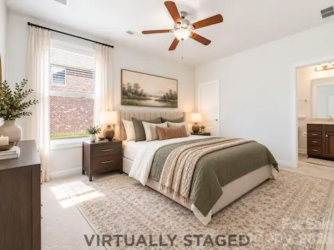 A Welcoming First-Level Guest Suite | Virtually Staged — Imagine this flexible main-level space as a beautifully appointed guest retreat. With convenient access to a full bathroom, it offers overnight guests or extended family a comfortable space of their own and provides an appealing option for multigenerational living.